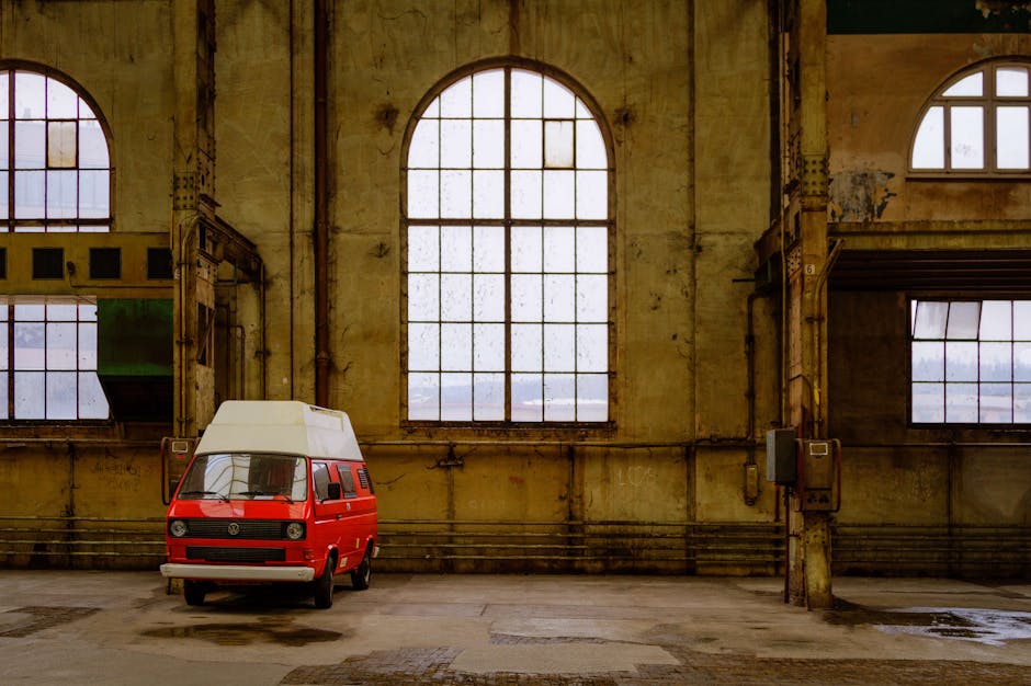 Red vintage Volkswagen van parked in an old industrial warehouse in Winterthur, Switzerland.